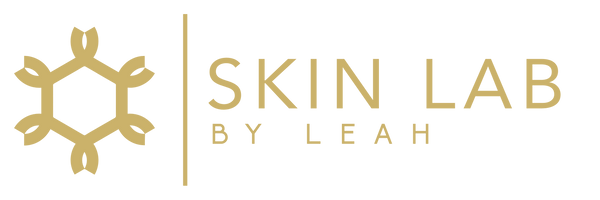 Logo for "Skin Lab by Leah" featuring a stylized hexagonal design to the left of the text.